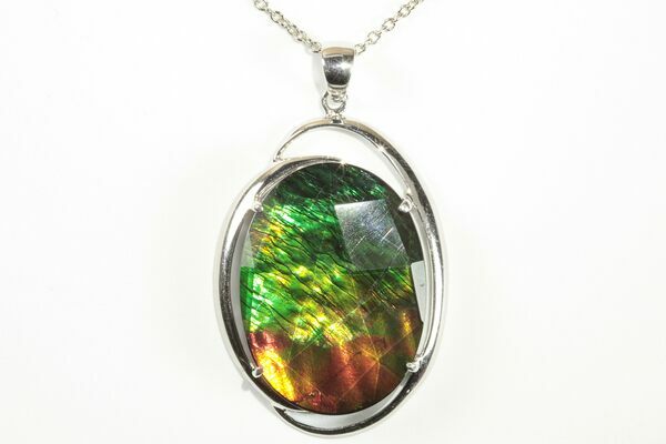 A brilliant, ammolite gemstone pendant fashioned by Korite.